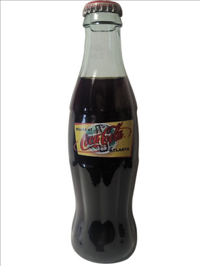 Coca-Cola Glass Contour Bottle with Red Cap and Yellow Label